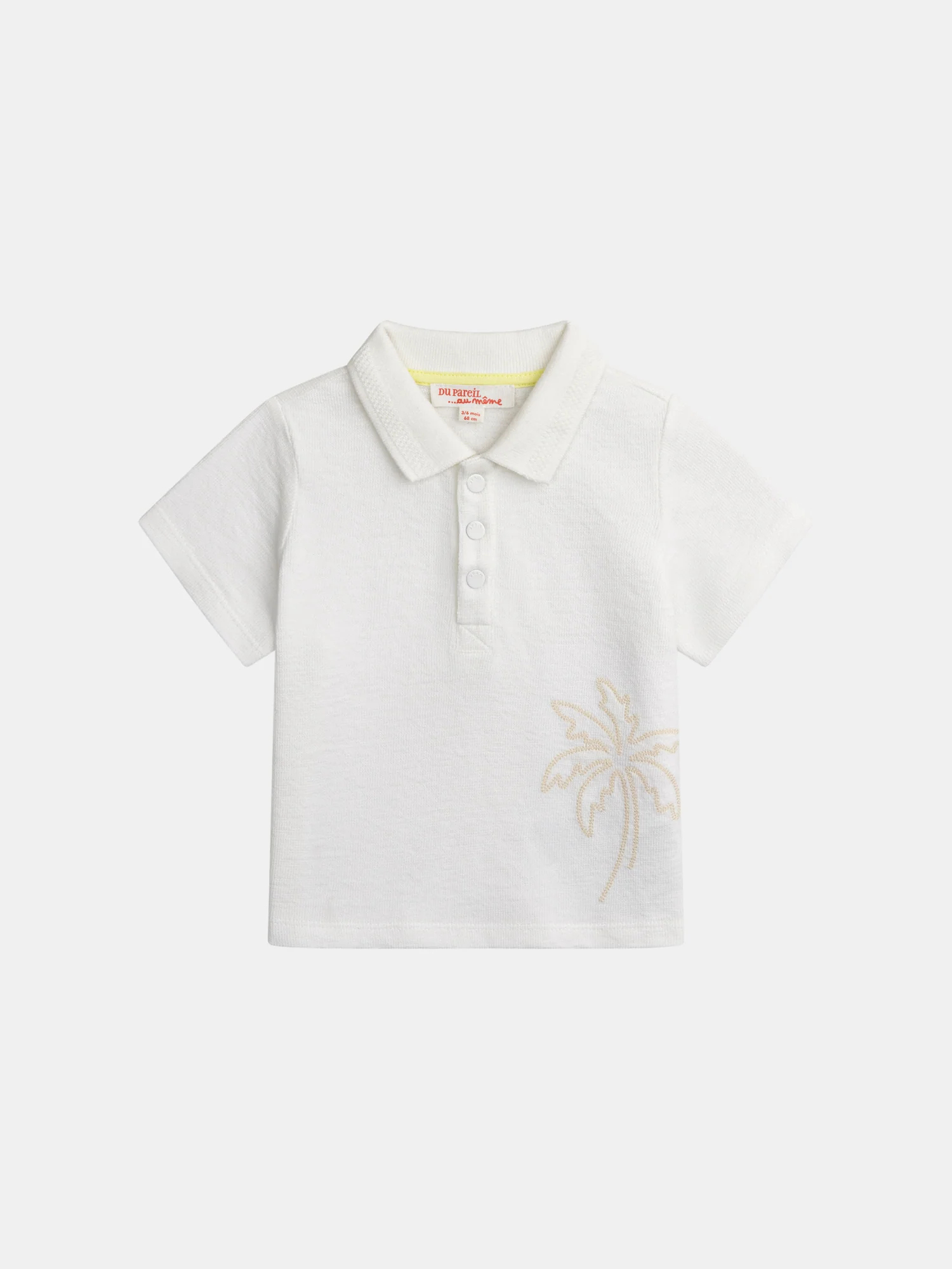 Polo ecru con ricamo di palma per bambino